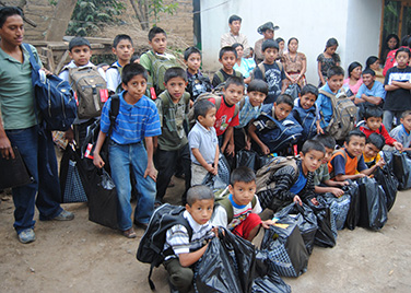 Boys with school supplies